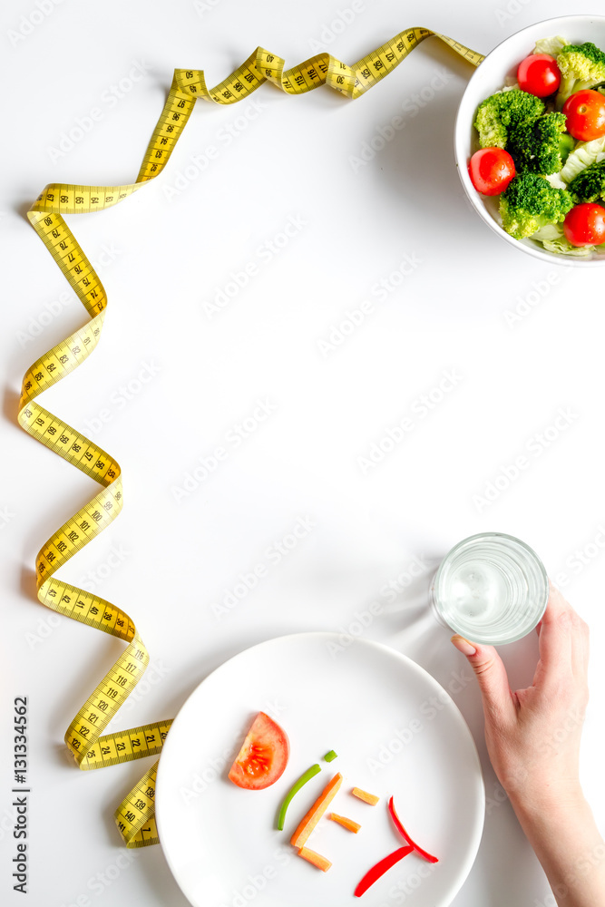 concept slimming diet fresh vegetables on white background top view