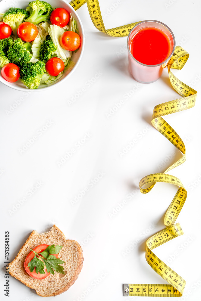 concept slimming diet fresh vegetables on white background top view