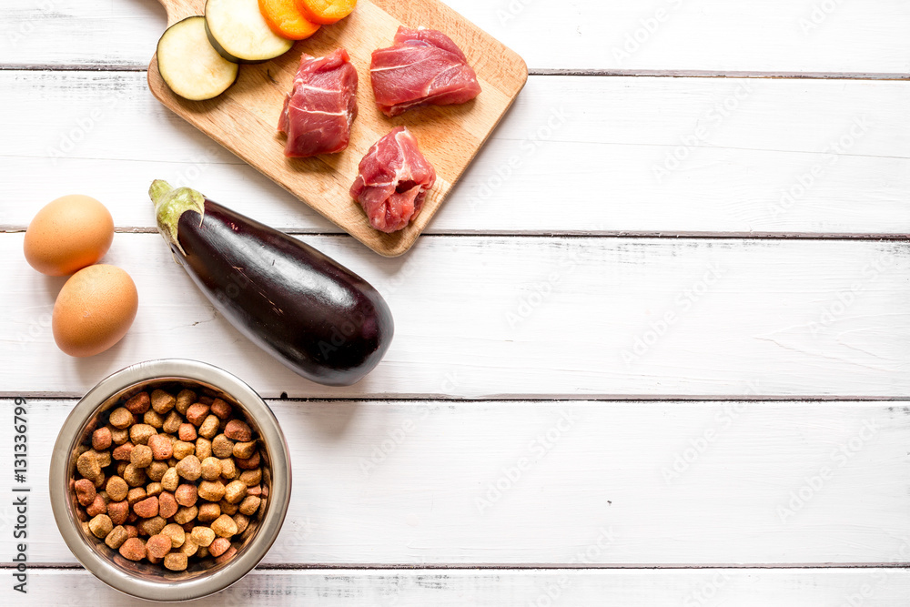 ingredients for pet food holistic top view on wooden background