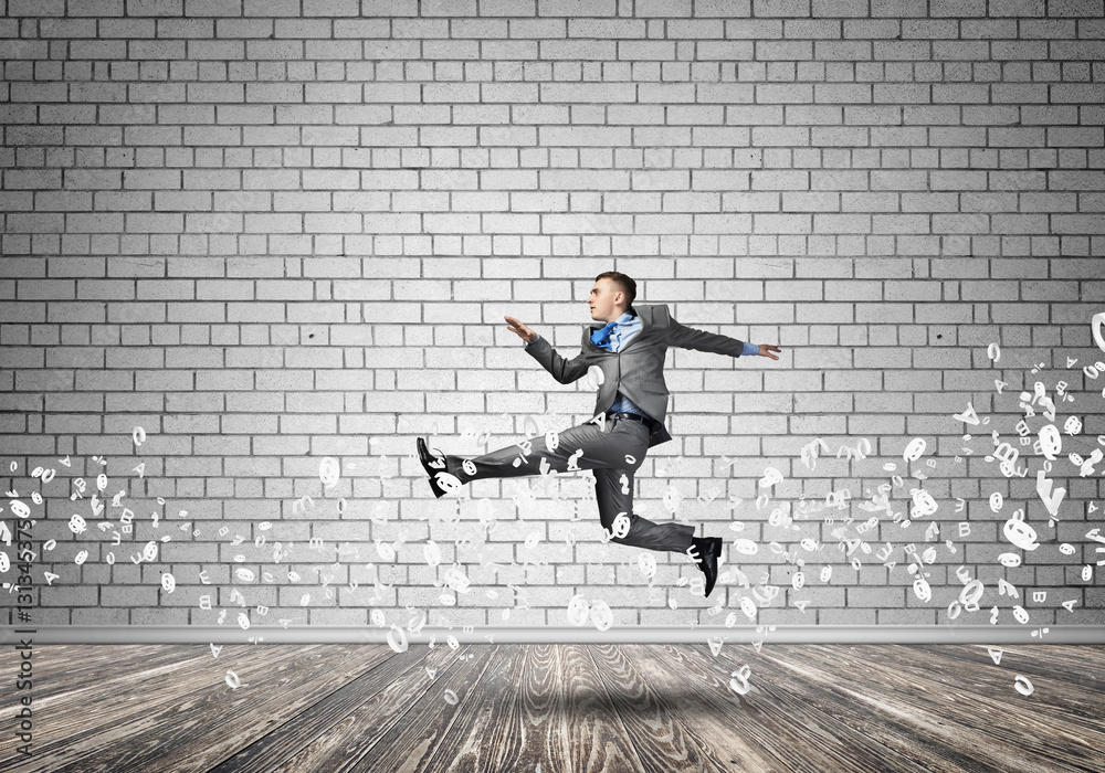 Businessman jumping high