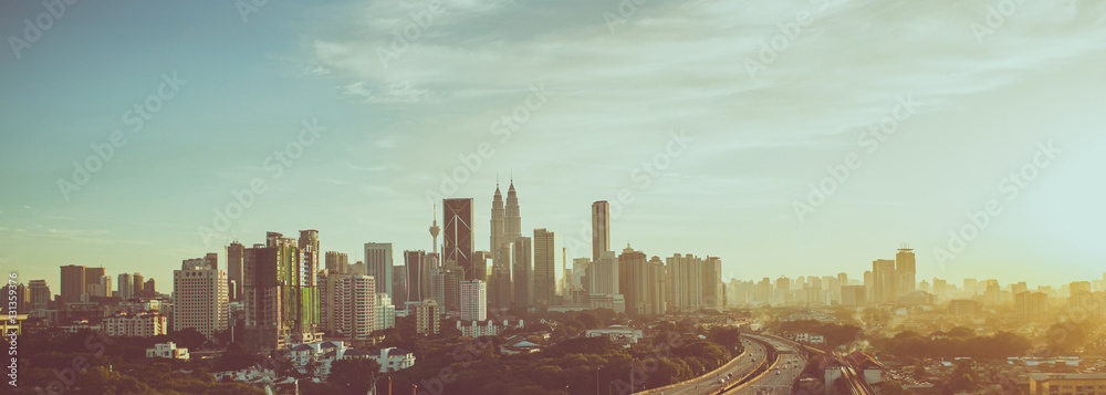 Dramatic scenery of elevated highway heading towards Kuala Lumpur city centre during sunset.