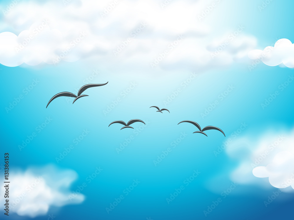 Birds flying in the blue sky