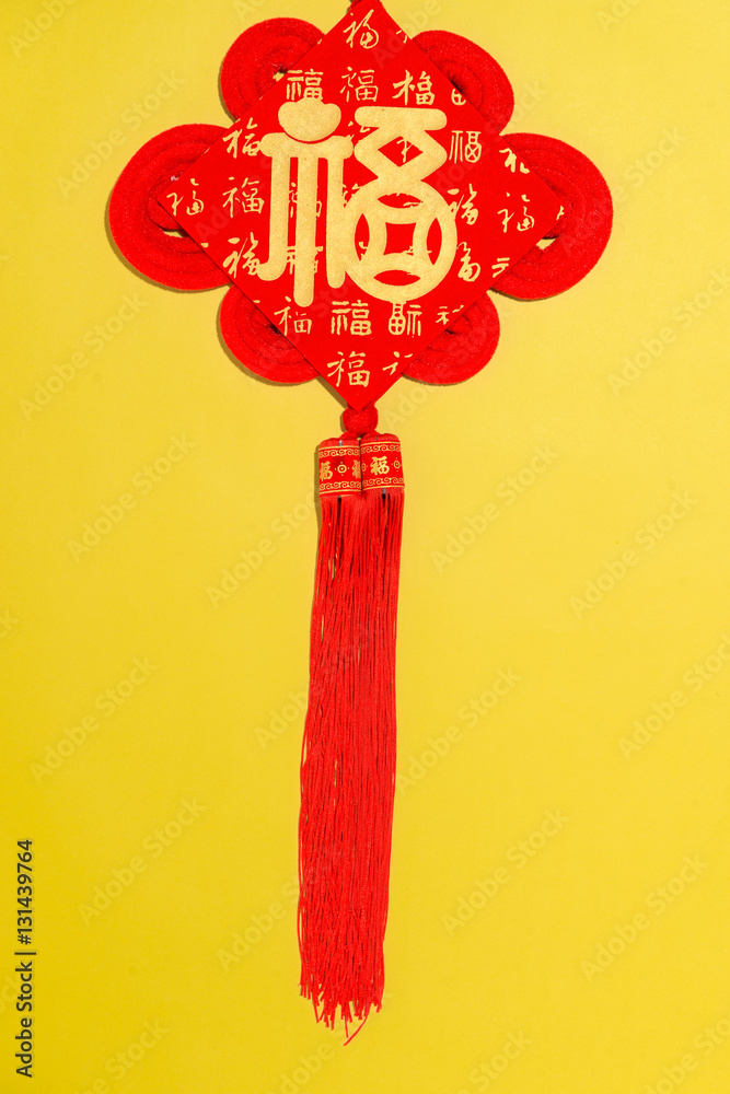 Chinese new year decoration items on yellow background.