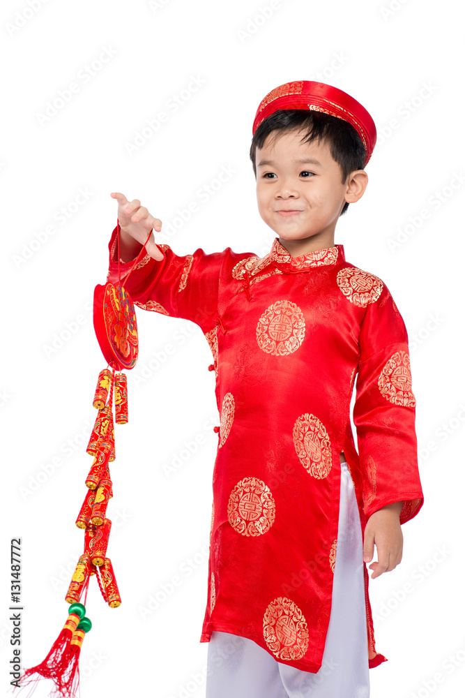 Portrait of a funny and exciting Vietnamese boy with firecracker