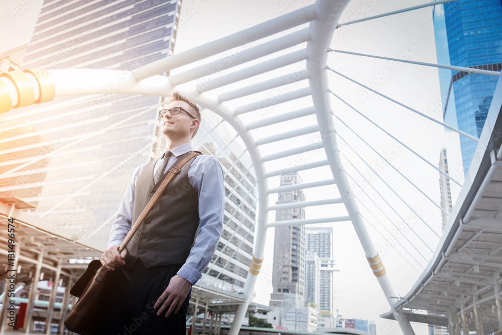 Portrait of an handsome businessman in an urban setting