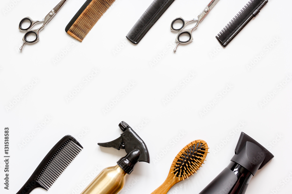 combs and hairdresser tools on white background top view