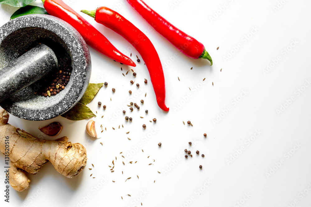 spices and stone mortar white background top view mock up