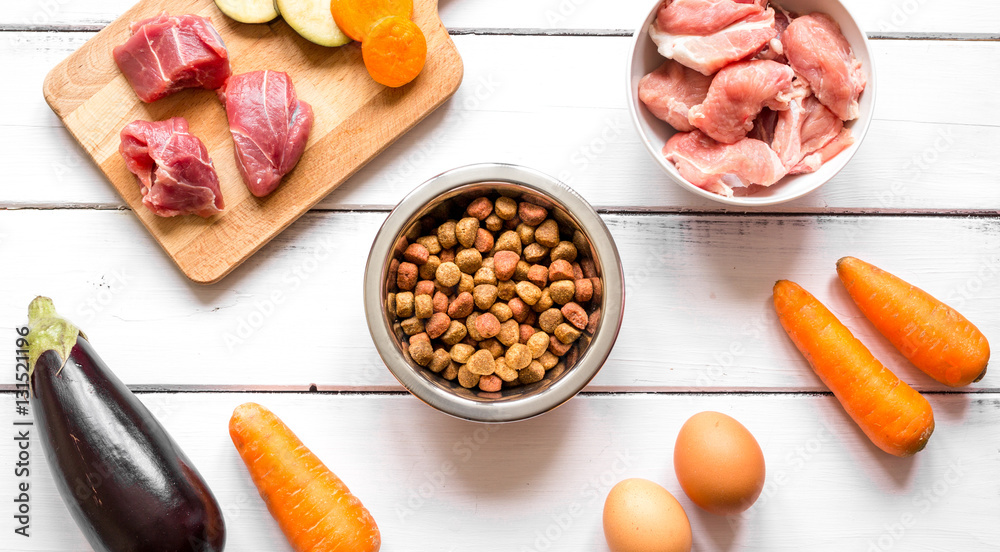 ingredients for pet food holistic top view on wooden background