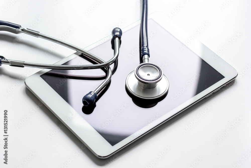 diagnostic of gadgets on white background with stethoscope