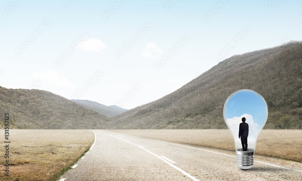 Businessman inside light bulb