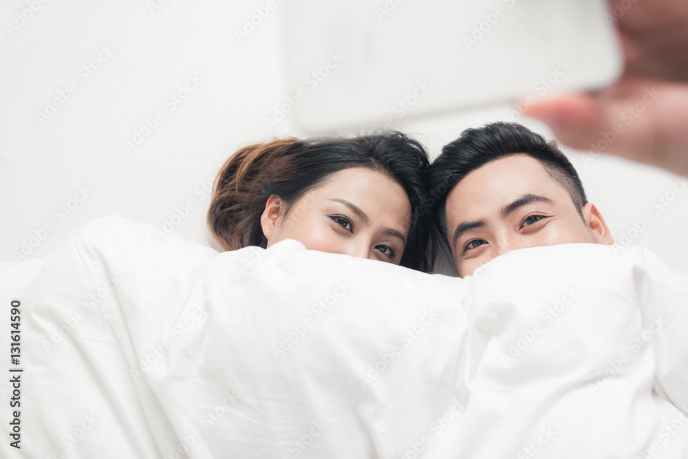 Couple taking selfie with phone