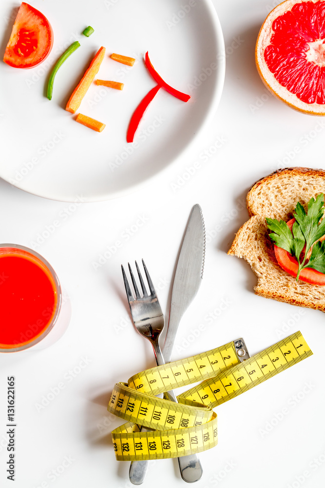 concept slimming diet fresh vegetables on white background top view