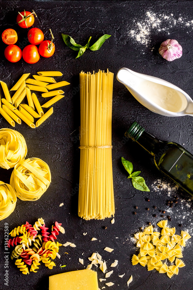 ingredients for cooking paste on dark background top view