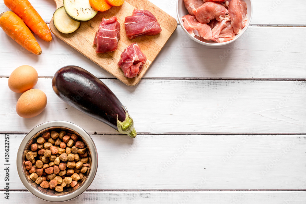 ingredients for pet food holistic top view on wooden background