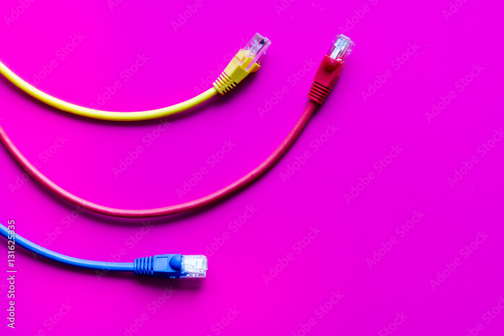 concept network internet cable on pink background close up