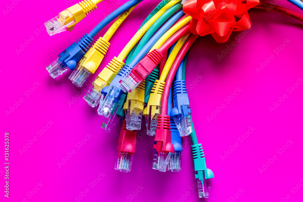 concept network internet cable on pink background close up