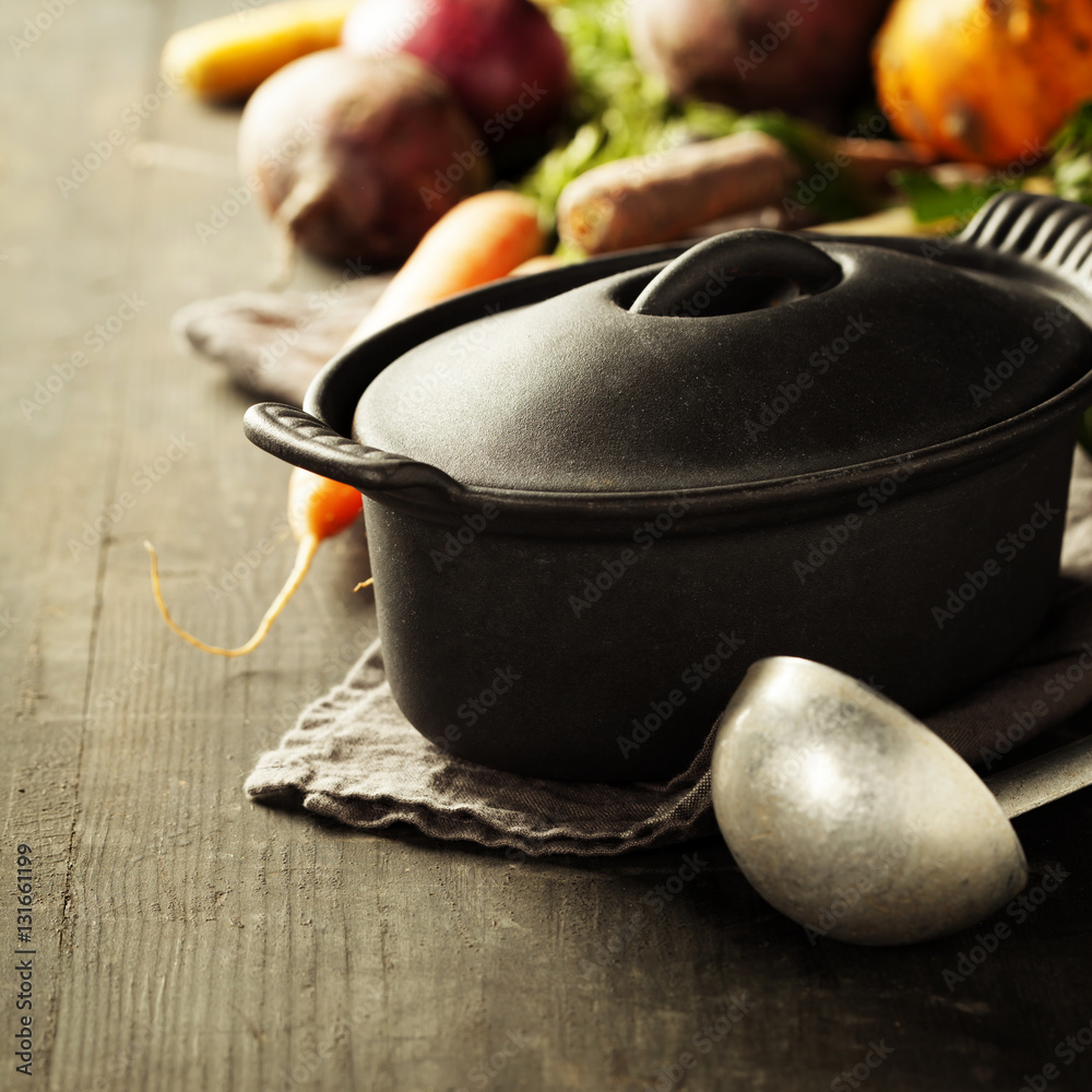 Cast iron pot and vegetables