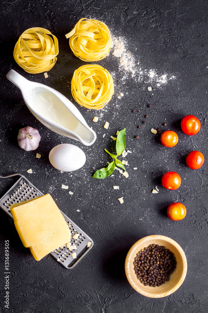 ingredients for cooking paste on dark background top view