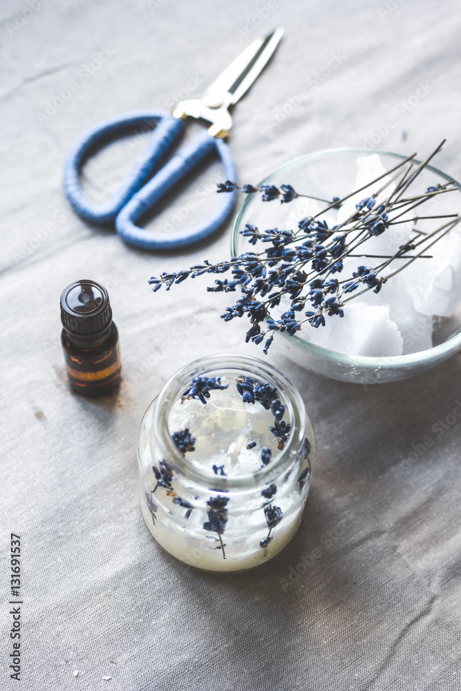 handmade candles with lavender on textile background