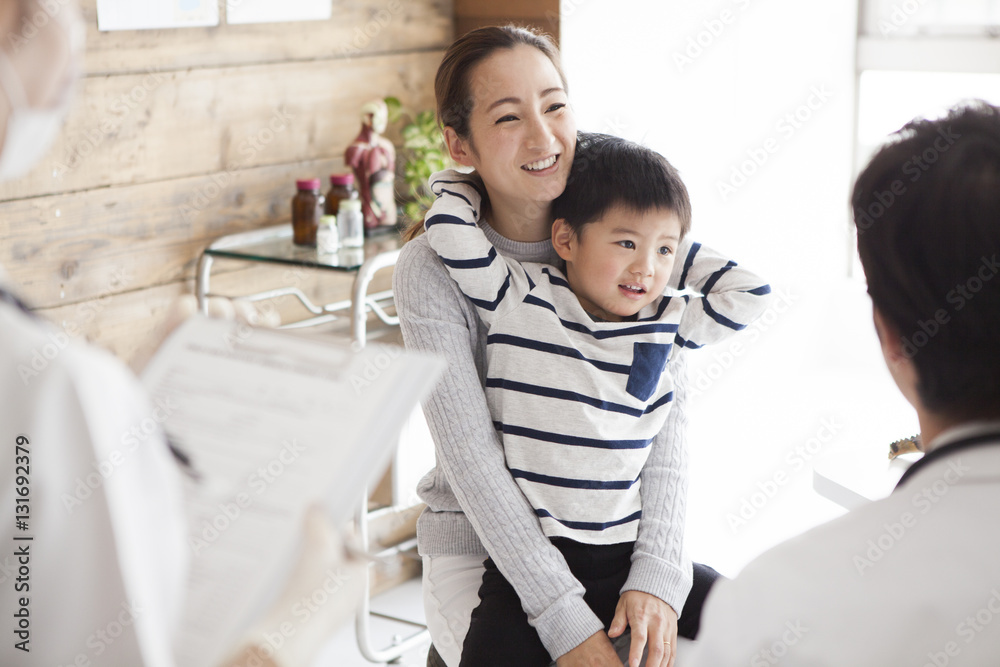 Mother and son are consulting with a clinic