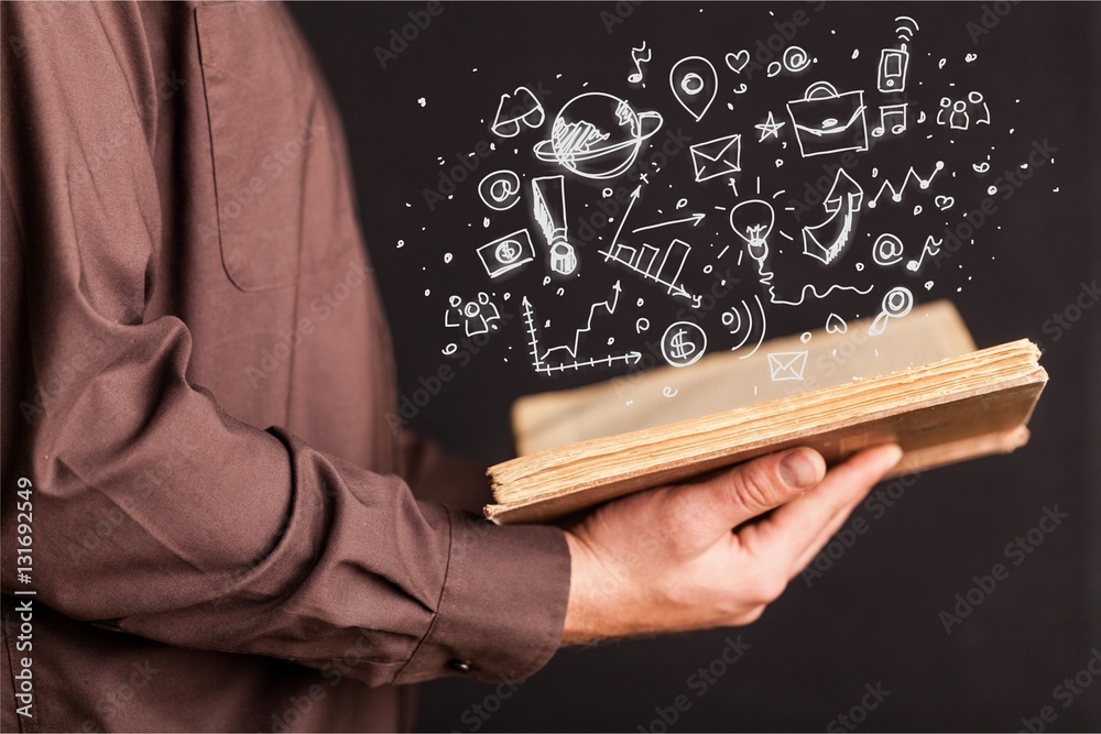 Hands holding a book.