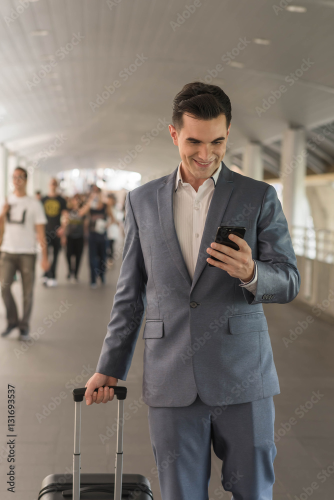 Westerner Business man talking via smart phone on the walk way w