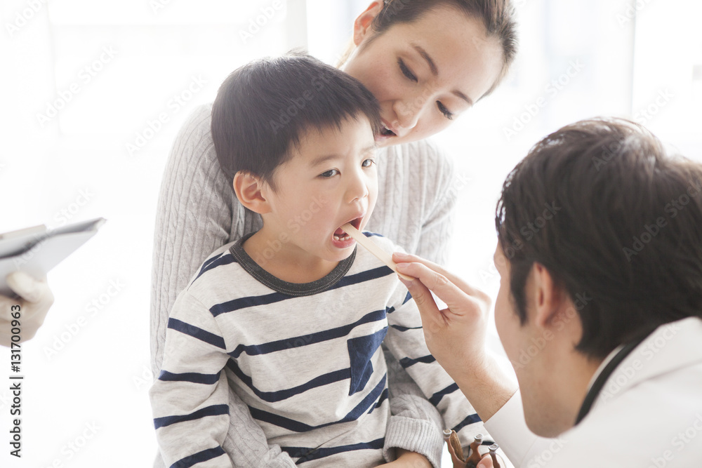 Child is under throat examination