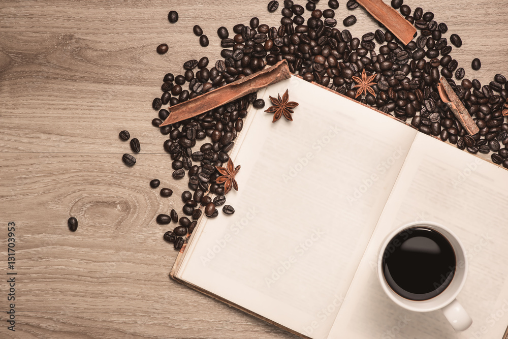 Coffee cup and coffee beans on table