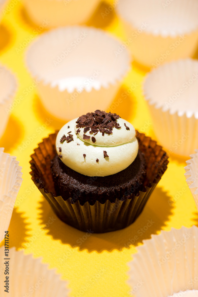 Birthday cupcake against a yellow background