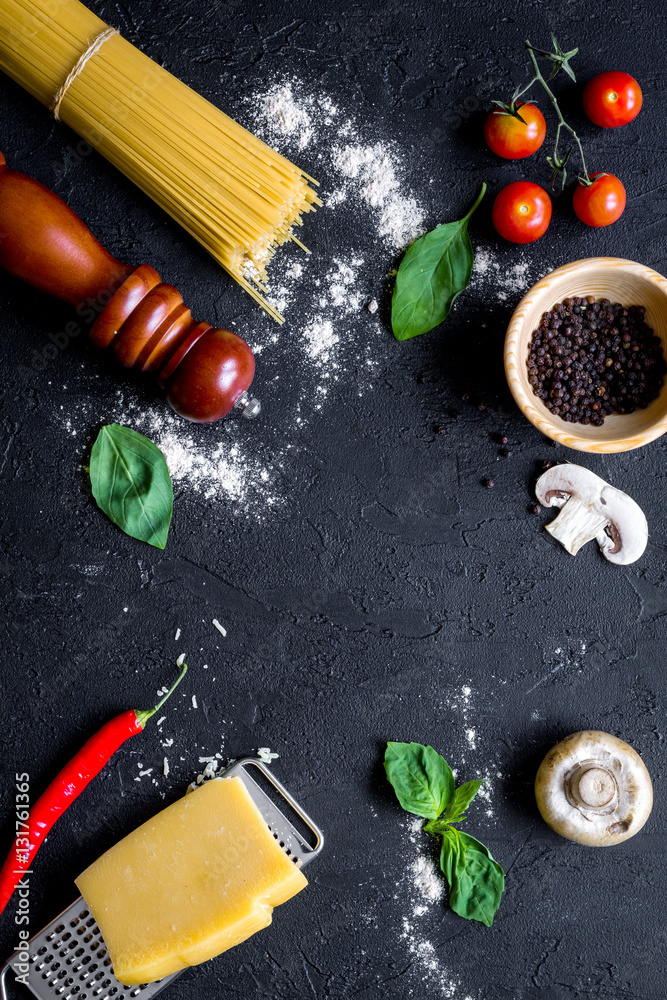 ingredients for cooking paste on dark background top view