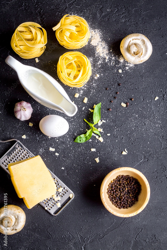 ingredients for cooking paste on dark background top view