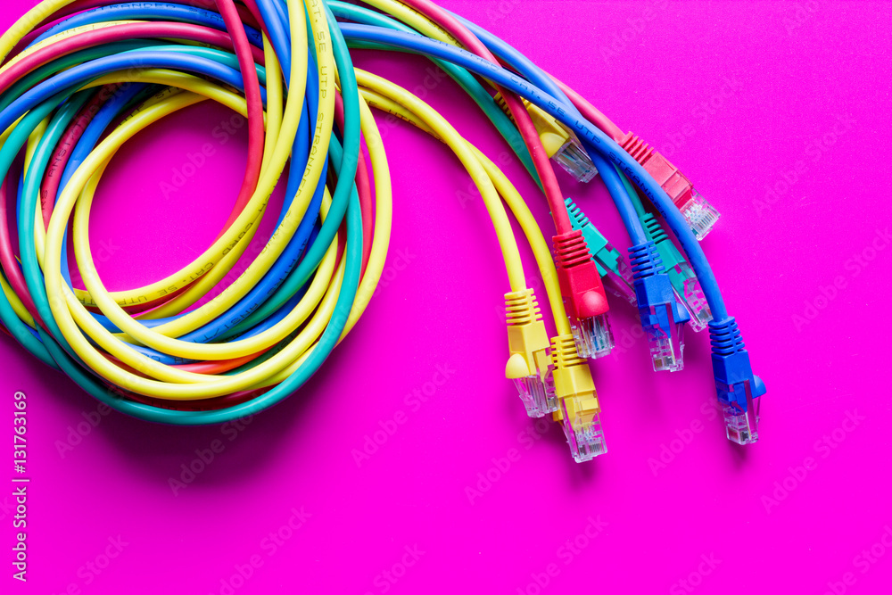 concept network internet cable on pink background close up