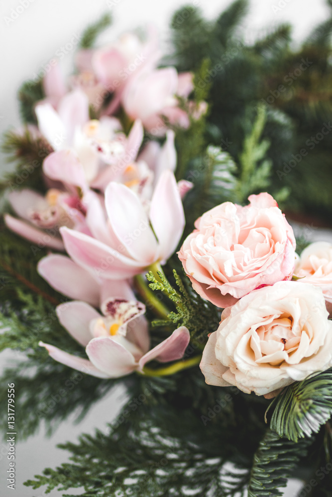 Florist makes Christmas wreath in workshop