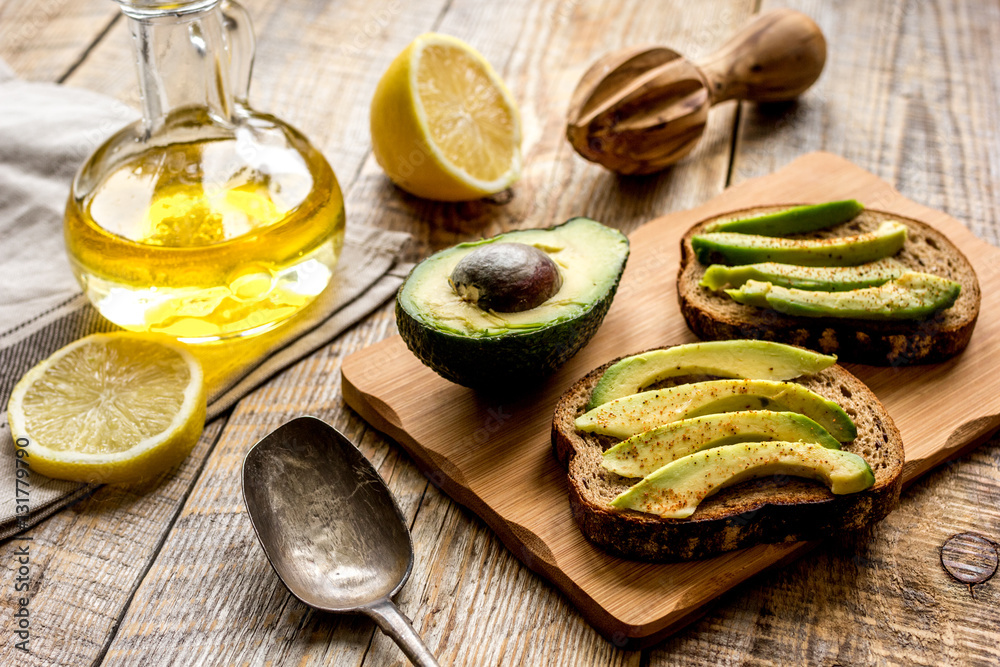 making sandwiches with avocado healthy organic food top view