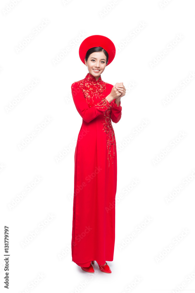 Young vietnamese woman in Ao Dai Dress with praying gesture wish