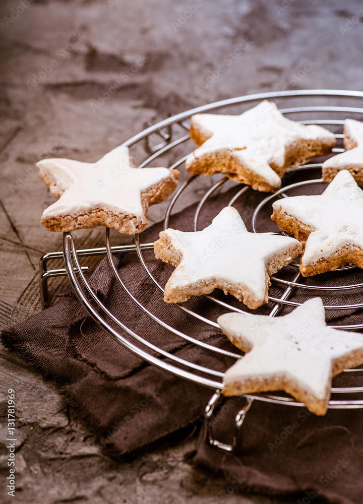 Christmas cinnamon star cookies on baking wire cooling rack. Zimtsterne.