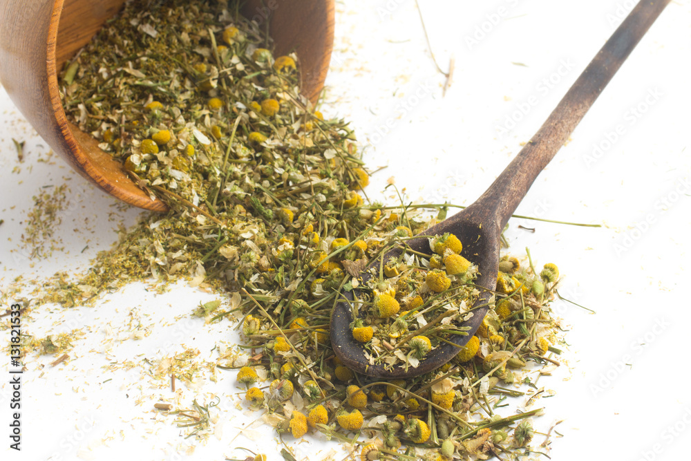 Dry Camomile Tea into a spoon