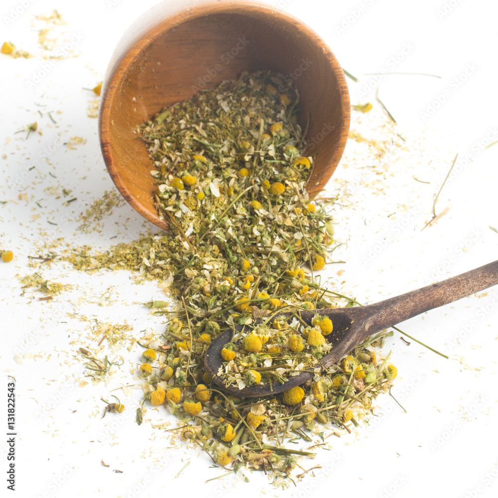 Dry Camomile Tea into a spoon