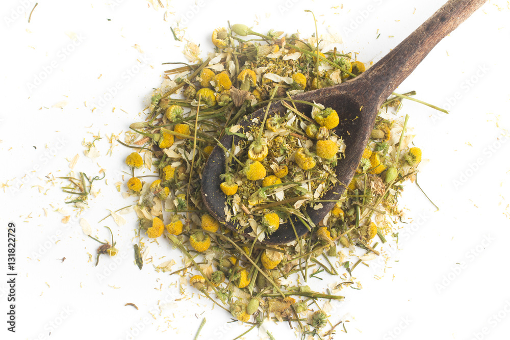 Dry Camomile Tea into a spoon