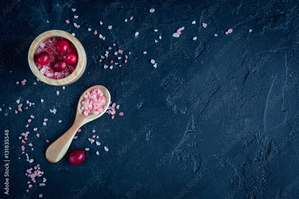 organic cosmetics with extracts of berries dark background top view