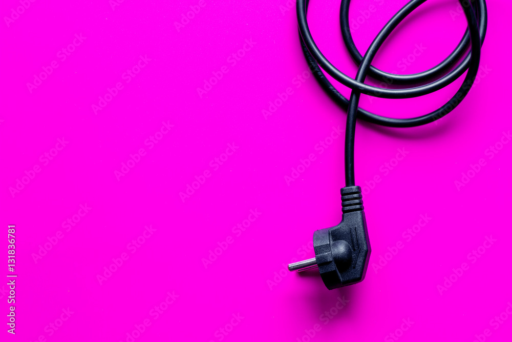 wires for charging on pink background top view