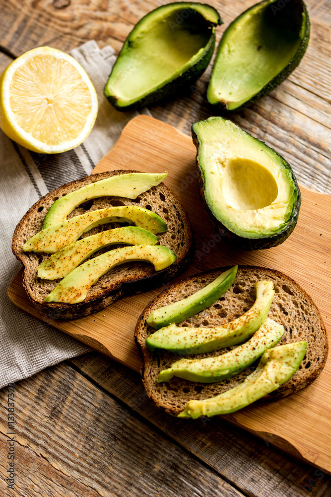 making sandwiches with avocado healthy organic food top view