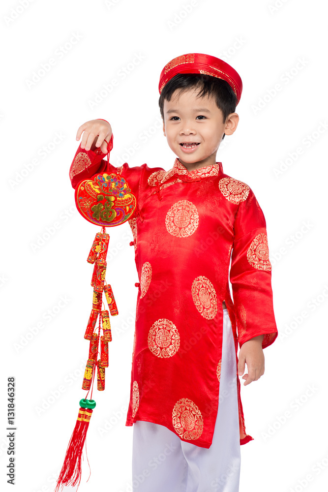 Portrait of a funny and exciting Vietnamese boy with firecracker