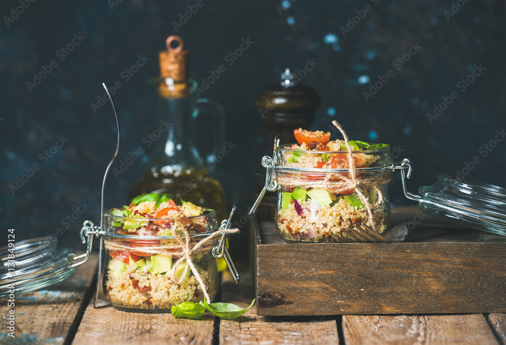 Homemade jar quinoa salad with cherry and sun-dried tomatoes, avocado and fresh basil. Detox, dietin