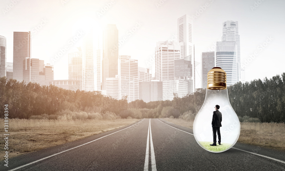 Businessman inside light bulb