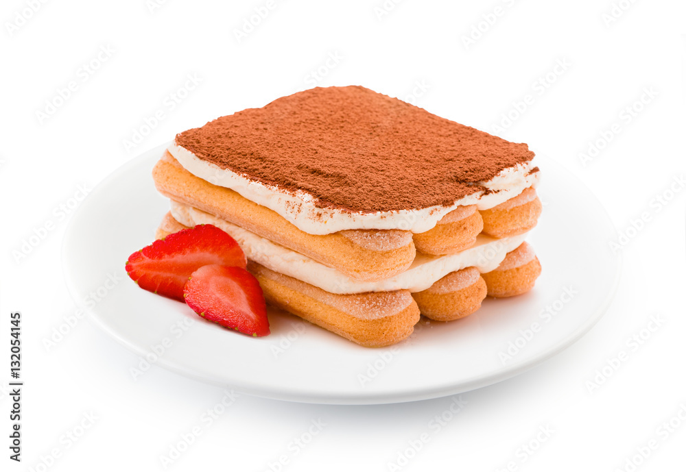 Tiramisu with strawberry on plate isolated. Clipping path