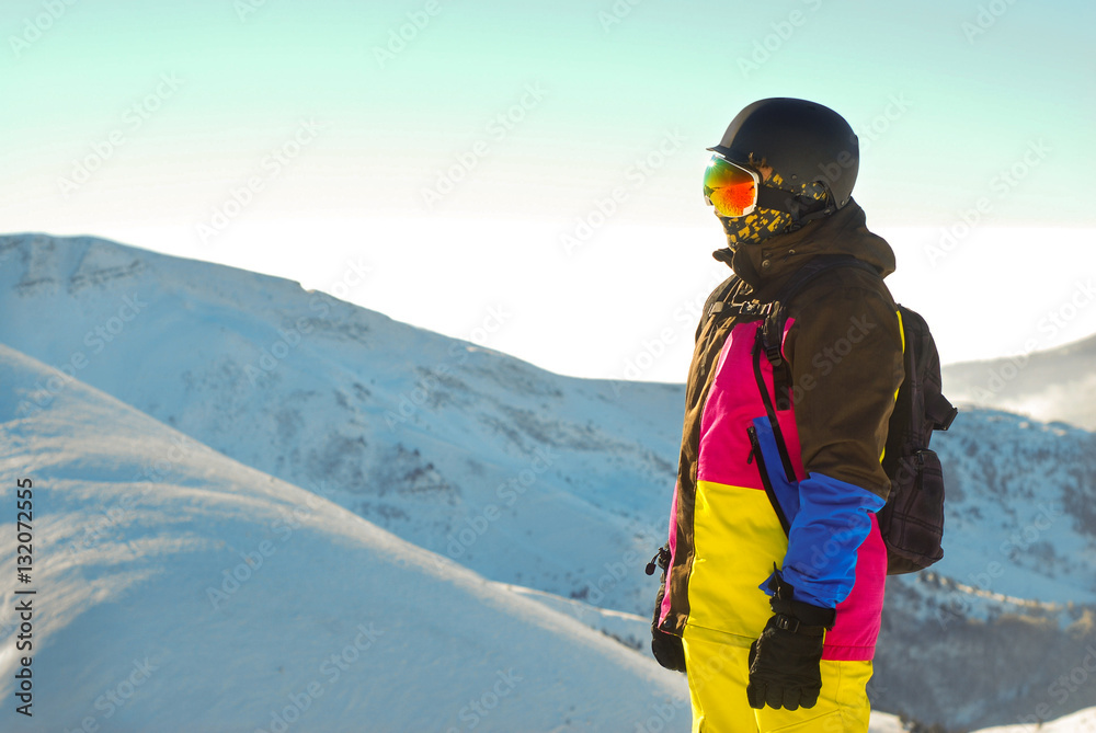 snowboarder standing on the top of the mountain