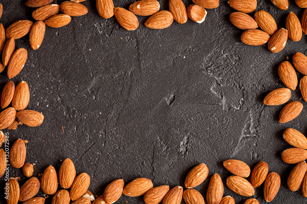 almonds on dark background top view