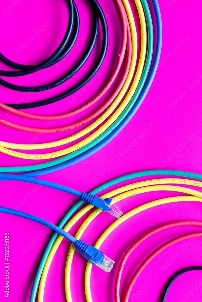 concept network internet cable on pink background close up