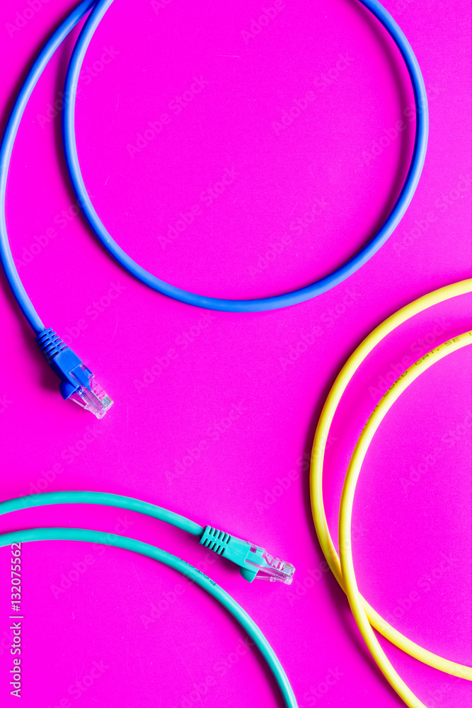 concept network internet cable on pink background close up